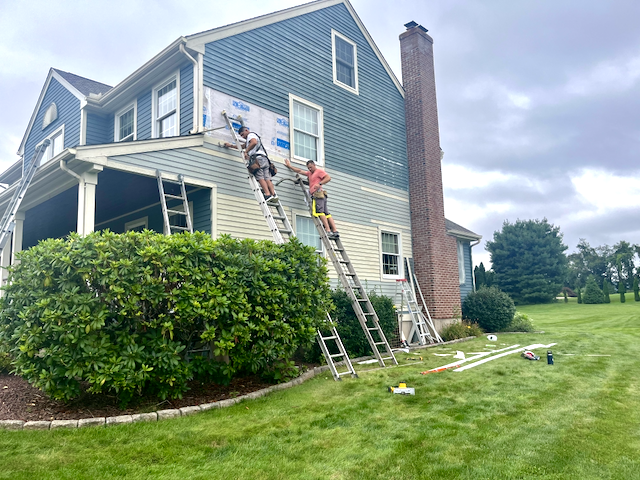 Exterior painting project with a vibrant, durable finish on a residential home