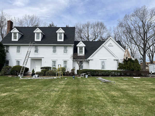 Residential home with freshly painted exterior and modern color scheme